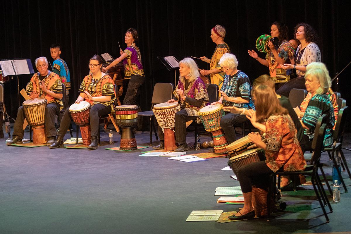 African Drumming Ensemble playing on a stage.